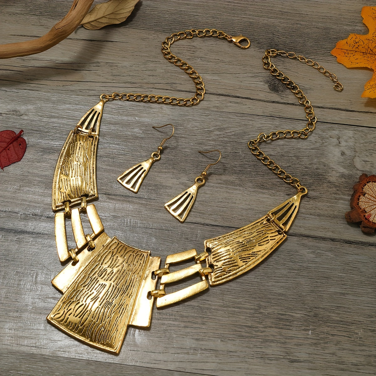 Vintage Jewelry Set includes 3 pairs of earrings and a necklace, featuring a geometric design in either silvery or golden tones. Choose the one that suits your style and make a stunning statement with these party accessories.