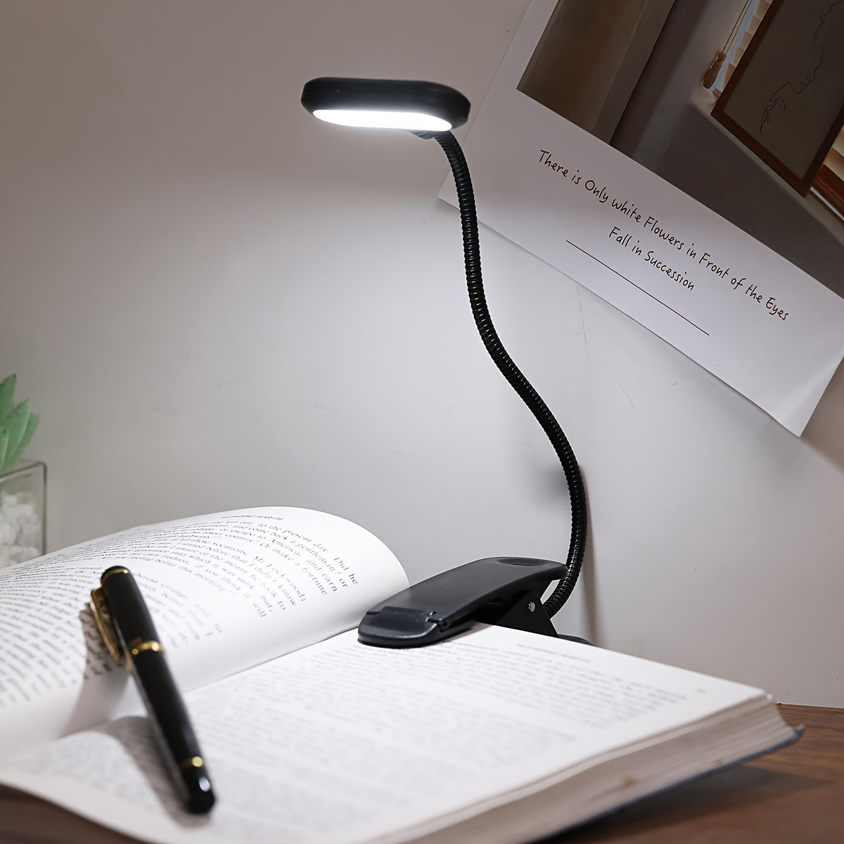 Portable battery-powered clip-on book light with a flexible hose, ideal for reading in small spaces or as a bedside night light.