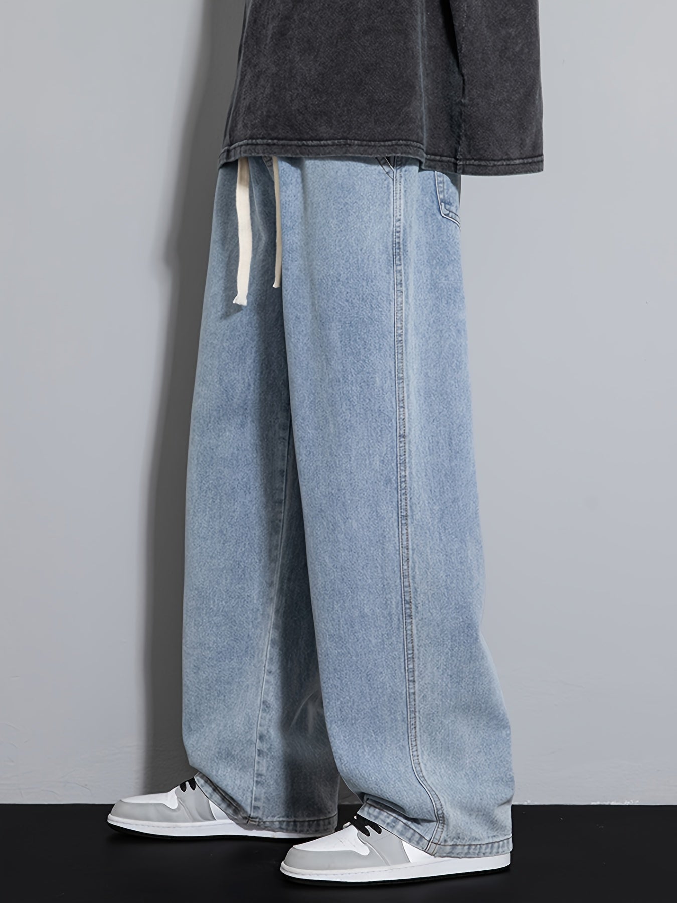 Men's wide leg denim jeans with drawstring waist, loose fit for hip-hop style.