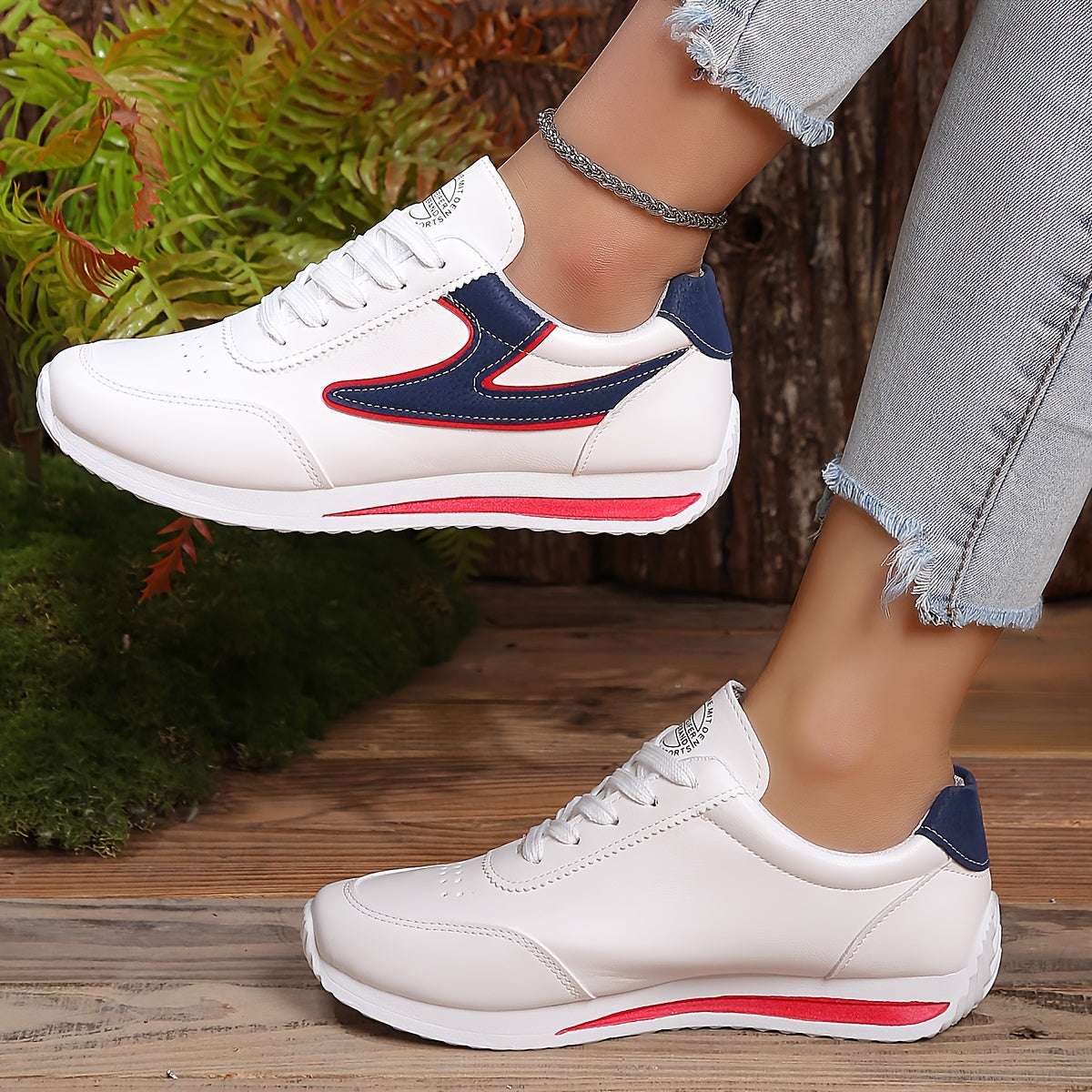 Women's flat lace-up sneakers for outdoor casual wear, comfortable low top shoes.