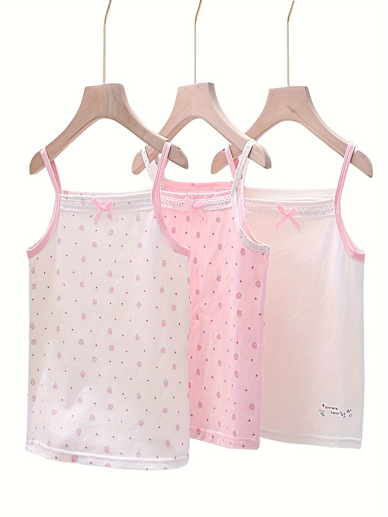 Set of 3 adorable bowknot tank tops for girls, featuring breathable cotton fabric, sleeveless design, and floral print. Ideal for year-round wear.