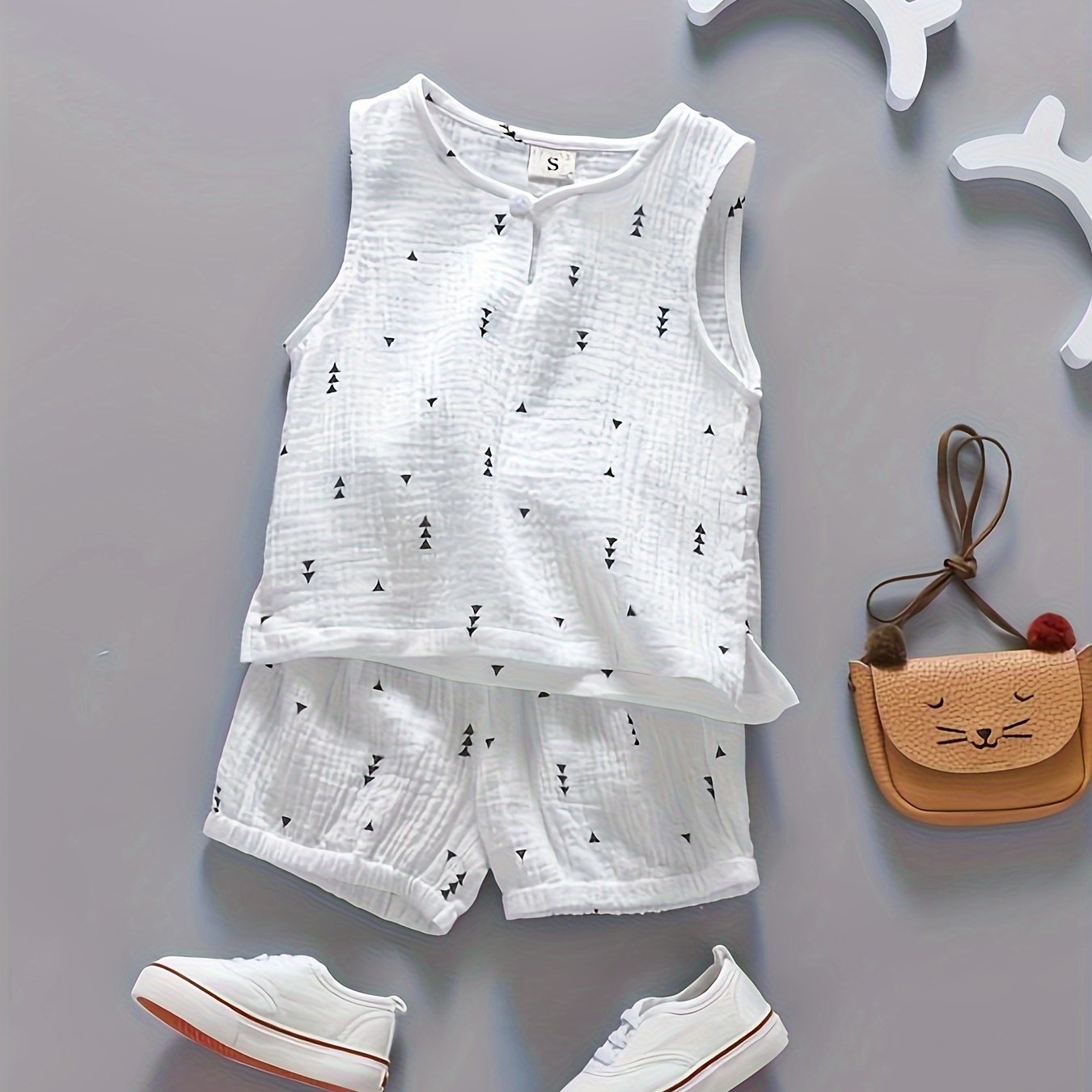 Boys' 2-piece cotton outfit with vest and elastic waist shorts for comfortable summer wear.