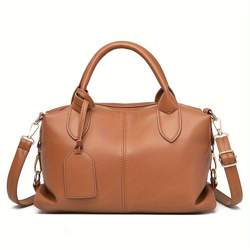 Stylish shoulder bag with removable strap and zip closure, perfect for everyday use.