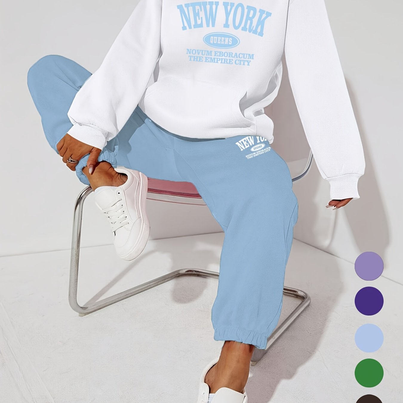 Women's casual 2-piece set featuring a long-sleeve hooded sweatshirt with drawstring and matching pants in polyester knit fabric with alphabet pattern. Suitable for all seasons, this