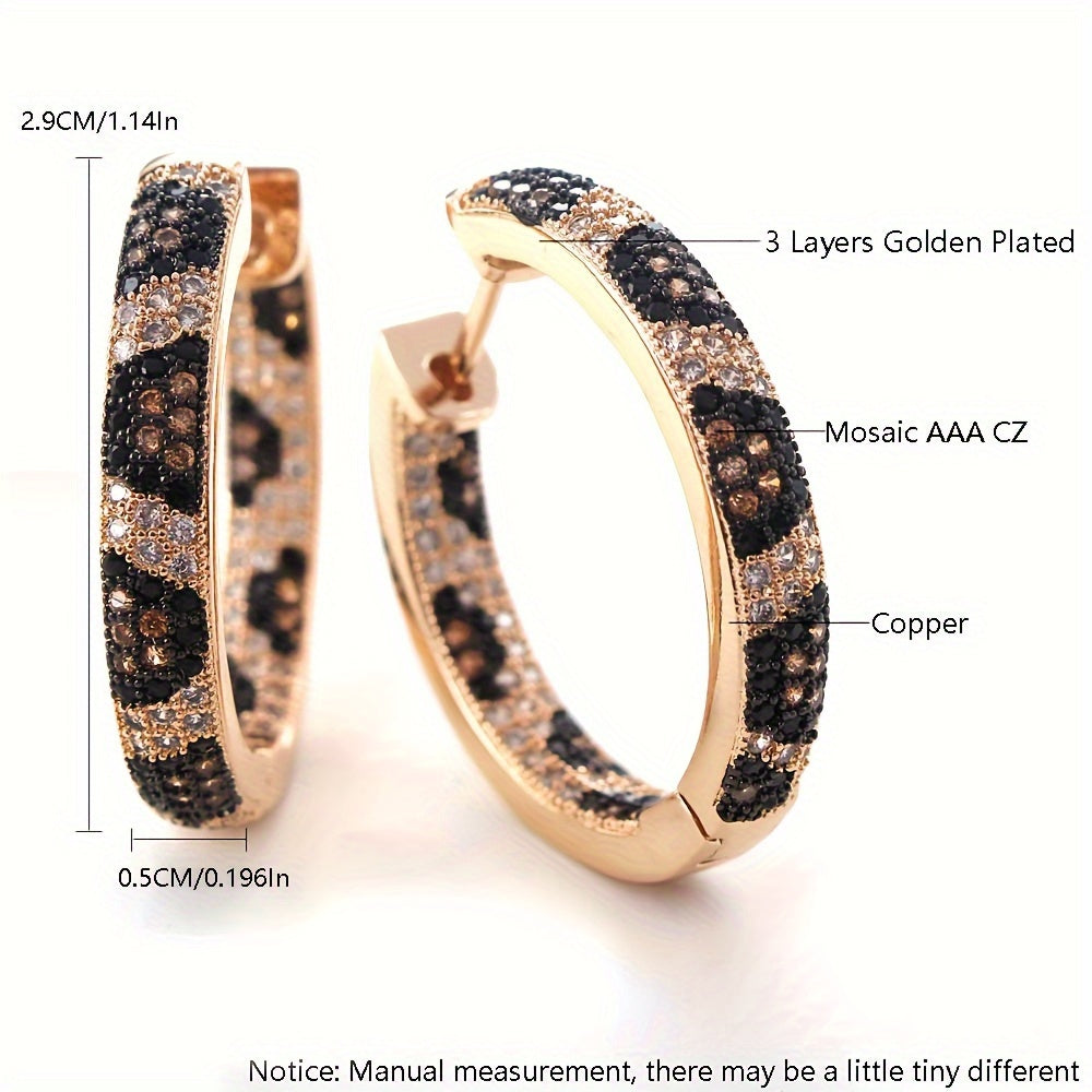 A set of stylish retro leopard print earrings with three rows of zirconia stones, crafted in copper for a bold and trendy look. These earrings are perfect for adding a touch of luxury to any outfit, and make a great gift for birthdays or just to treat