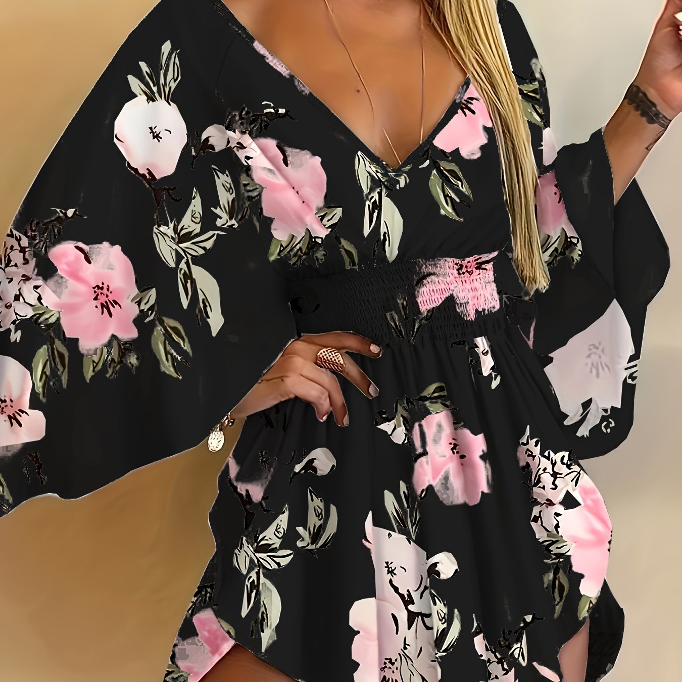 Floral print V-neck dress with tie waist and flare sleeves for spring and summer.