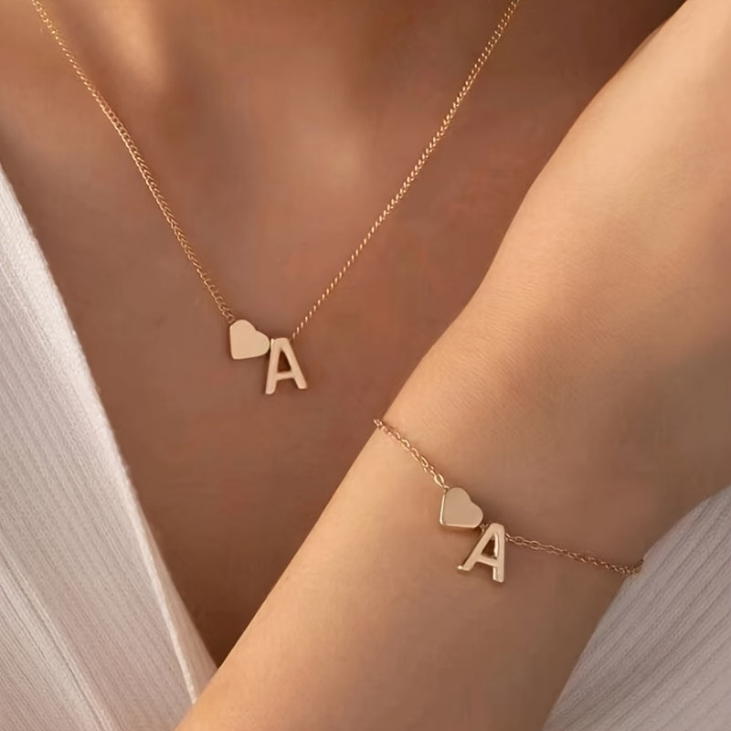 Retro metal necklace and bracelet set with English letter design.