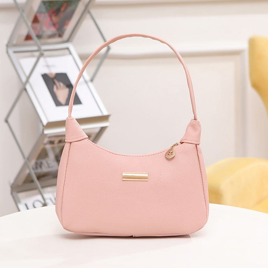 Chic crossbody bag with zipper closure and metal decor in cream, pink, black, or brown. Ideal for casual, school, or daily commute.