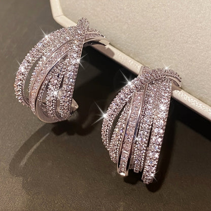 These stunning multi-layer earrings are adorned with intricate synthetic zirconia stones. The elegant C-shaped design makes them perfect for women to wear on their everyday outings, special occasions, or high-end events.