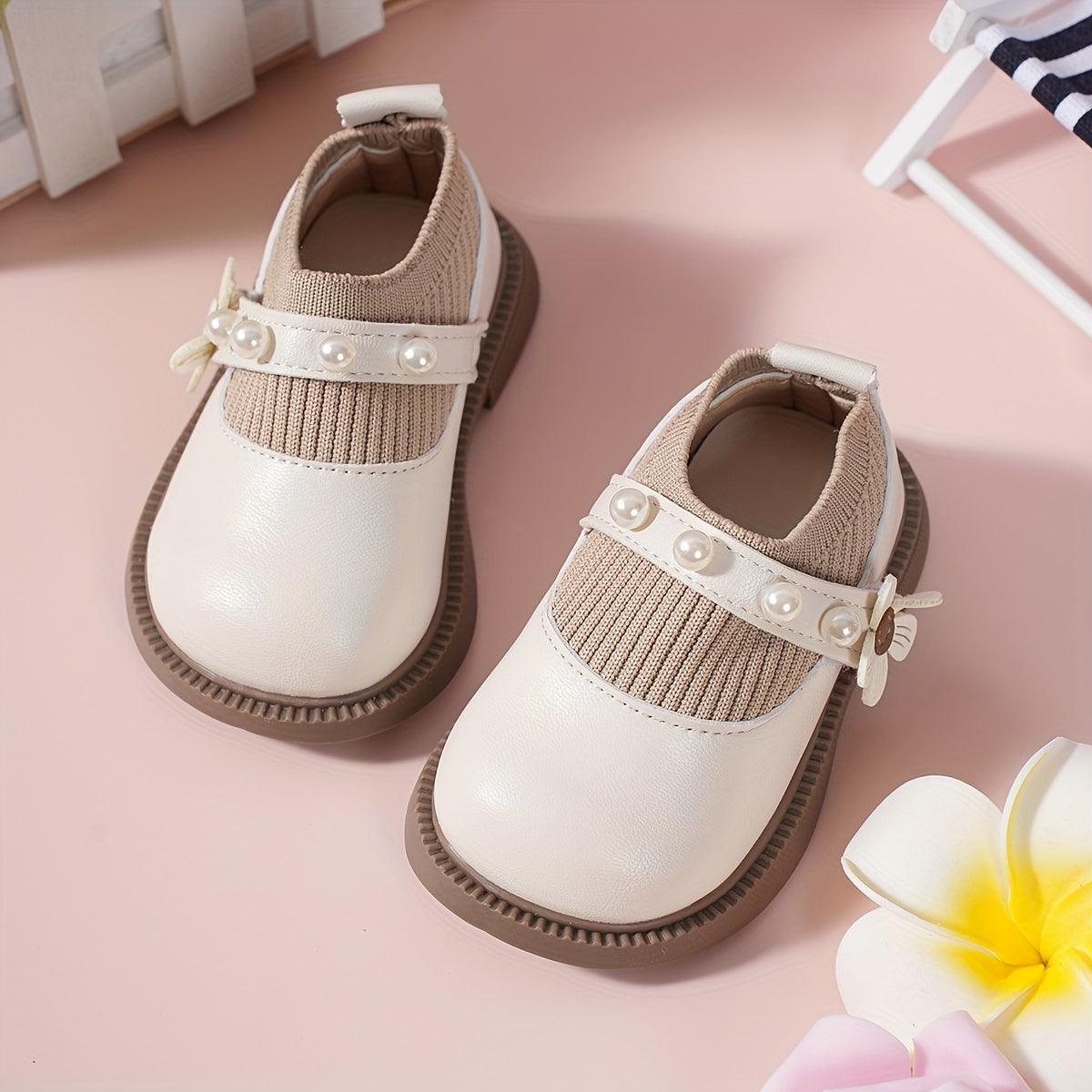 Pair of stylish baby shoes with flower bead accents, perfect for all seasons, including princess flats.