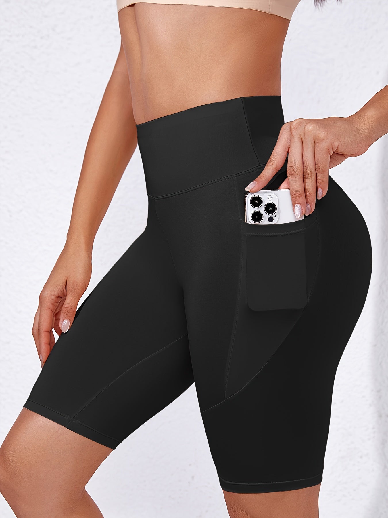 High-waisted compression workout shorts with pocket for women in black, hand washable.