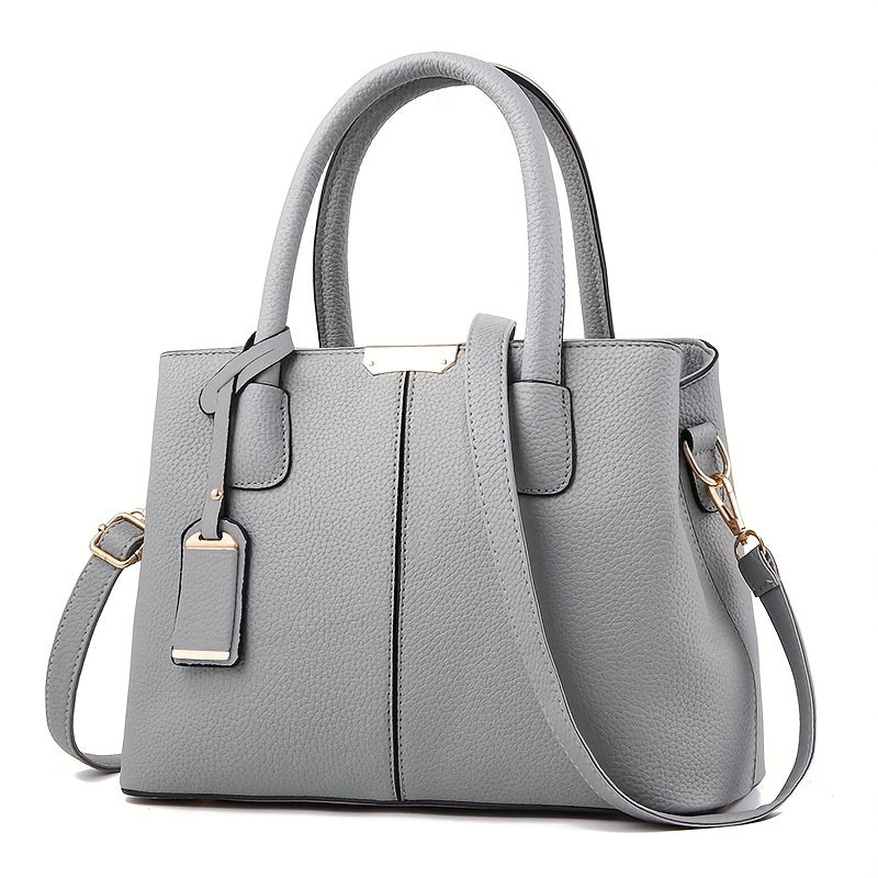 Gray PU tote bag with adjustable straps and zip closure; versatile as shoulder or crossbody bag with spacious capacity and polyester lining.