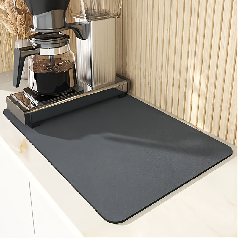 Sleek black dish drying mat absorbs moisture quickly and stays in place on kitchen countertops or tabletops. Ideal for dishes, bowls, and grinders in kitchen, coffee stations, or pet areas.