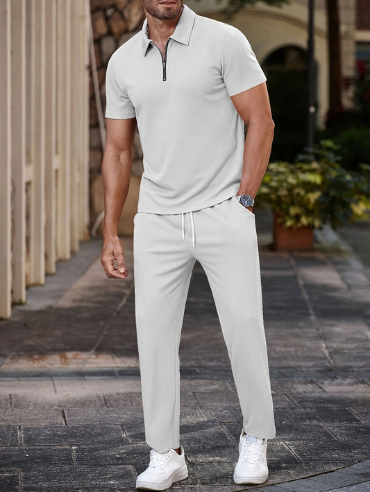 Men's casual outfit: half-zip short sleeve shirt and drawstring pants for outdoor activities.