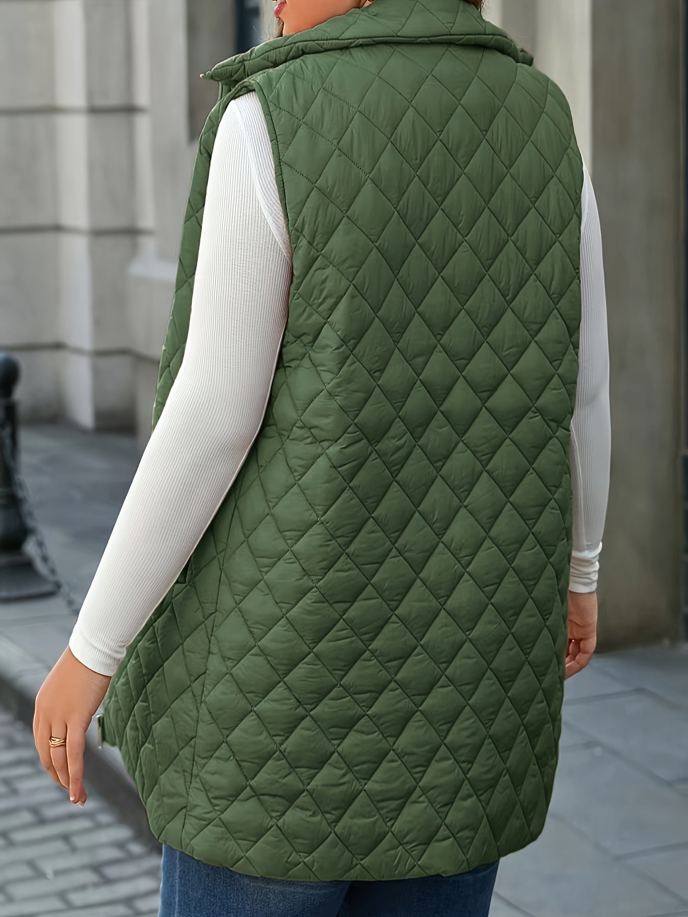 Chic plus-size quilted vest with stand collar and mid-length zip-up closure for winter wear.