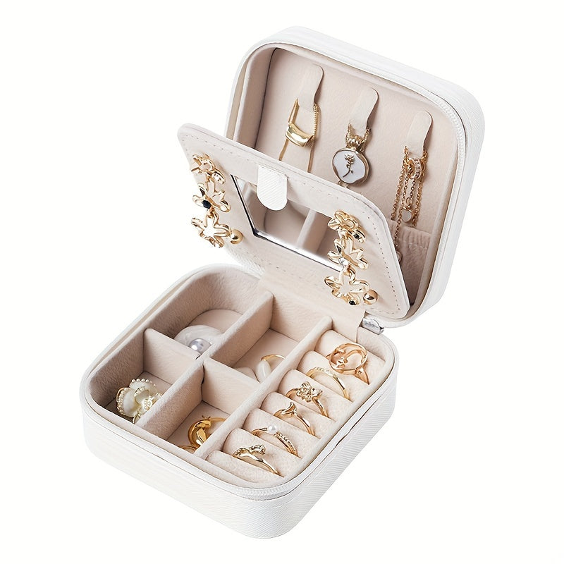 Compact and stylish portable jewelry box with mirror, zipper, and flip cover. Ideal for storing rings, earrings, and necklaces on-the-go.