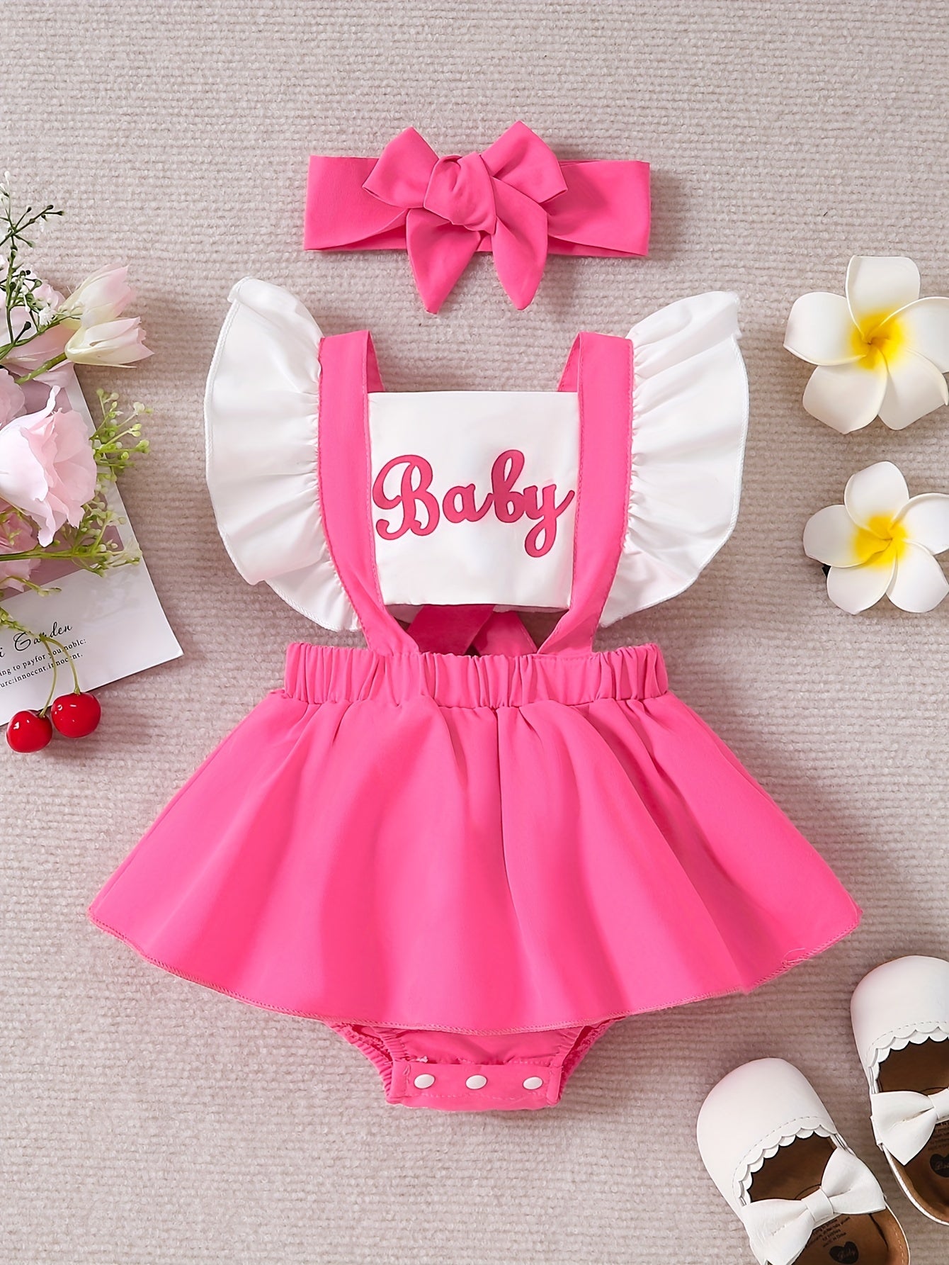 Sweet baby romper dress with cute color contrast letter print and flying sleeves.