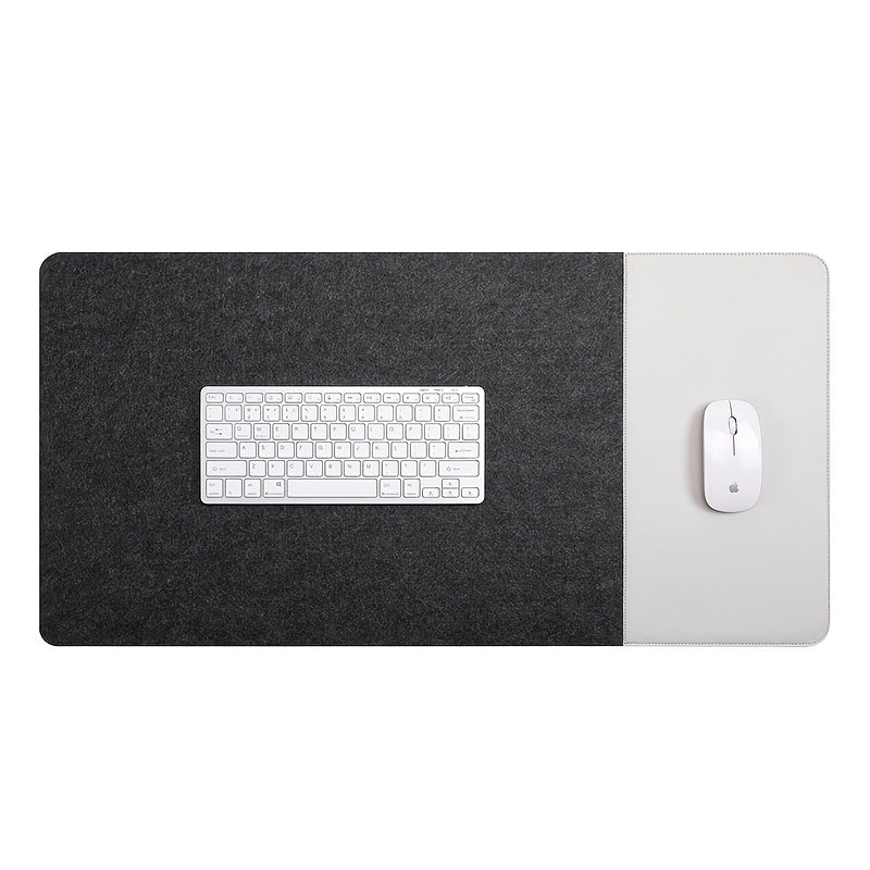 Large gaming mouse pad with anti-slip felt and faux leather, suitable for e-sports, writing, and office use. Includes wrist support and keyboard pad.