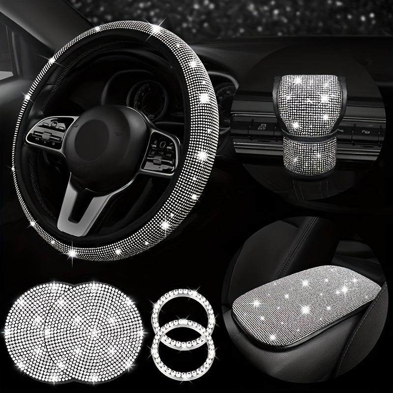 7-piece set of bling car steering wheel covers with cup holder coaster and gear shift knob cover. Made of polyester fiber with auto diamond detailing. Includes armrest pad and start button