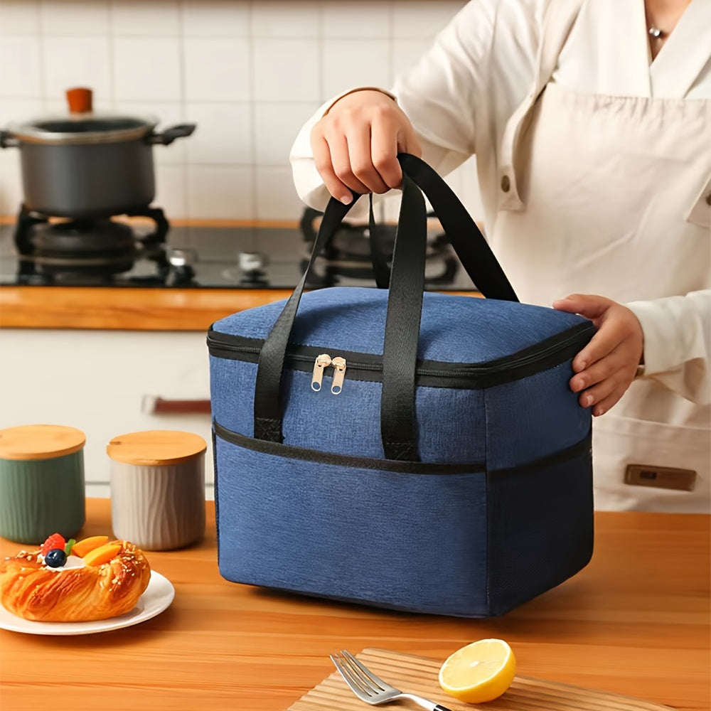 Insulated lunch bag with aluminum lining, made with double-layered Oxford fabric for a large capacity. Features front and side pockets, perfect for office, picnic, camping, or travel. Convenient and portable food storage option that is machine washable.