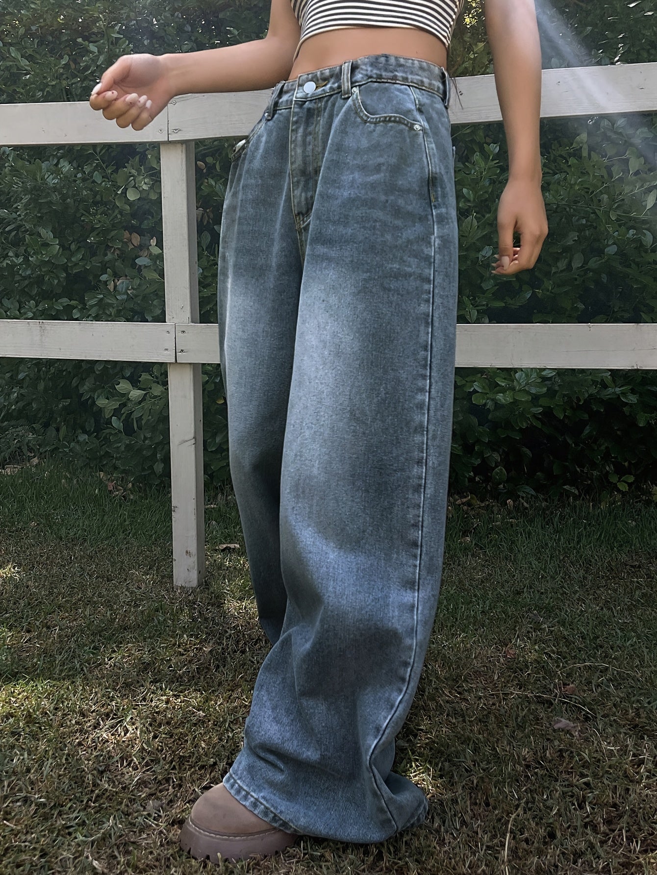 Water washed blue extra long wide leg jeans for women, perfect for casual autumn wear.