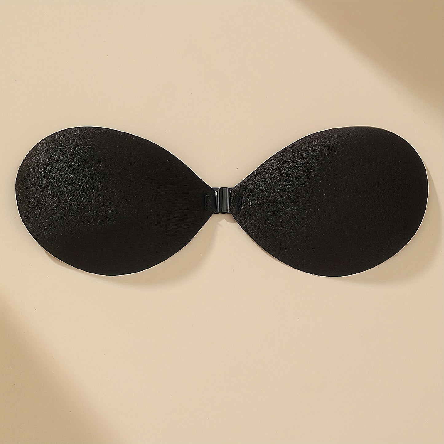 1 pair of invisible fold, reusable, and seamless women's bras for backless and strapless wear.