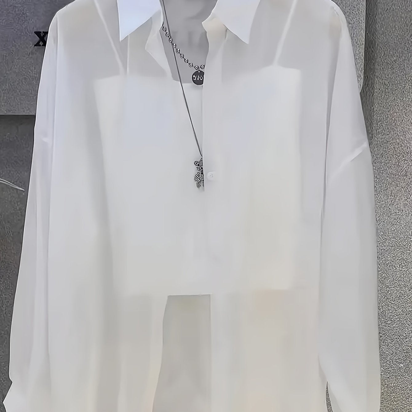 Casual women's shirt with buttons, sheer long sleeves for spring and fall.