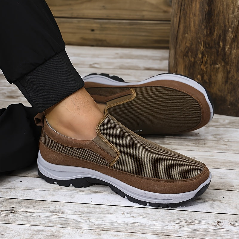 Men's slip-on sports sneakers with breathable fabric upper, round toe, and faux sole for daily wear and running.