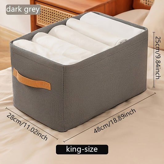 Get organized in style with this King-Size Dark Grey Non-Woven Fabric Storage Box featuring a sleek faux leather handle. This lightweight and foldable wardrobe organizer container measures 27.99cm in height, 27.99cm in width, and 47.9cm in depth, making