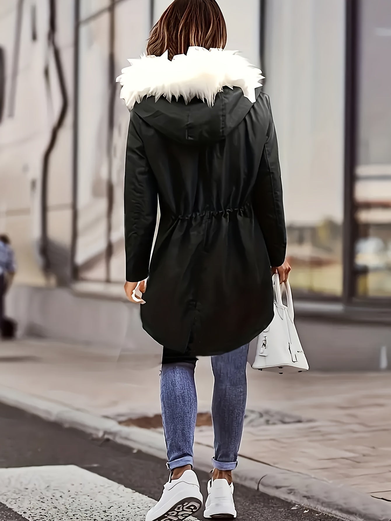 Women's plus size winter coat with fuzzy contrast, drawstring waist, full zipper, warm pockets, and long sleeves.