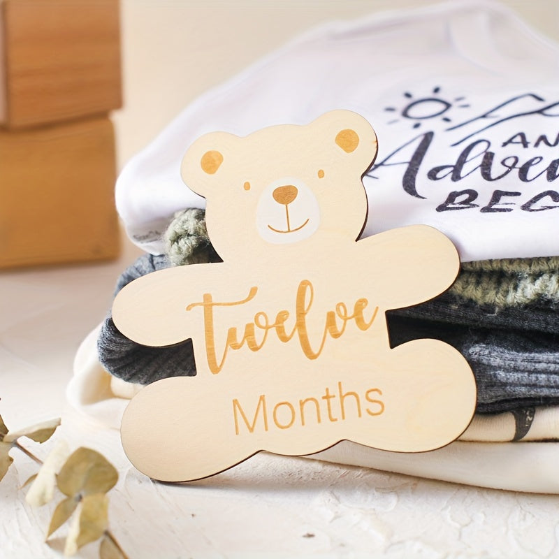 Wooden birthday lettering, growth milestone cards, sweet bear accents, wooden milestone cards, adorable photo props, baby's first birthday celebration.