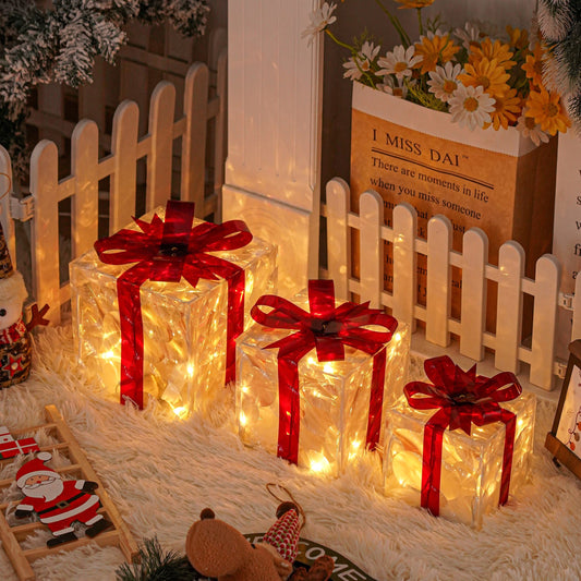 3 Christmas lighted gift boxes with warm white lights and red bows for decorating Christmas trees, yards, homes, and outdoor spaces.