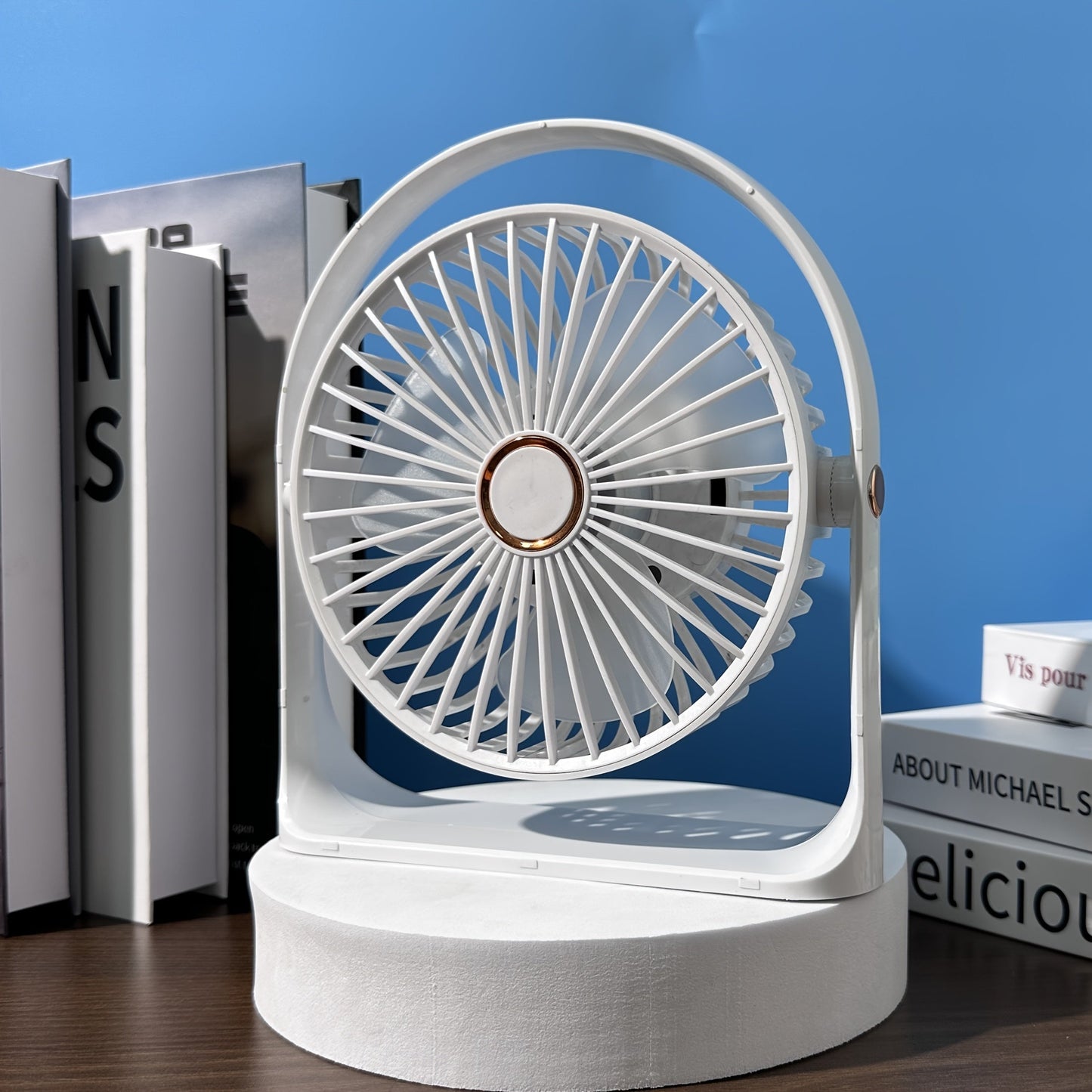 Introducing the Jkuoo Ultra-Quiet USB-C Desk Fan, a compact and portable cooling solution with powerful airflow and 5-speed adjustment. With a 360° tilt feature and ambient night light, this fan is perfect for both office and home use. Enjoy silent