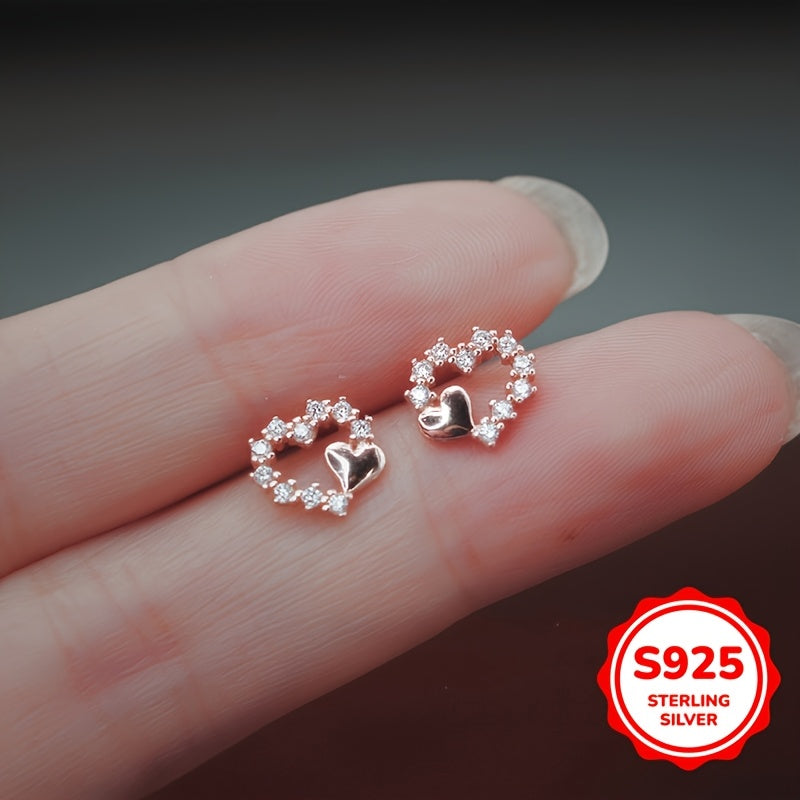 These graceful heart-shaped earrings are crafted from S925 silver with synthetic zirconia stones. Their simple and minimalist design is perfect for girls who prefer a cool and elegant style. These versatile earrings make a great gift for birthdays or