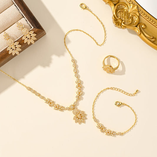 Luxurious 5-piece Jewelry Set for Women, Featuring 18K Gold-Plated Copper adorned with Synthetic Zirconia Stones in a Stunning Floral Design. Includes Necklace, Earrings, Bracelet, and Ring, Perfect for Everyday Wear or Special Wedding Occasions.