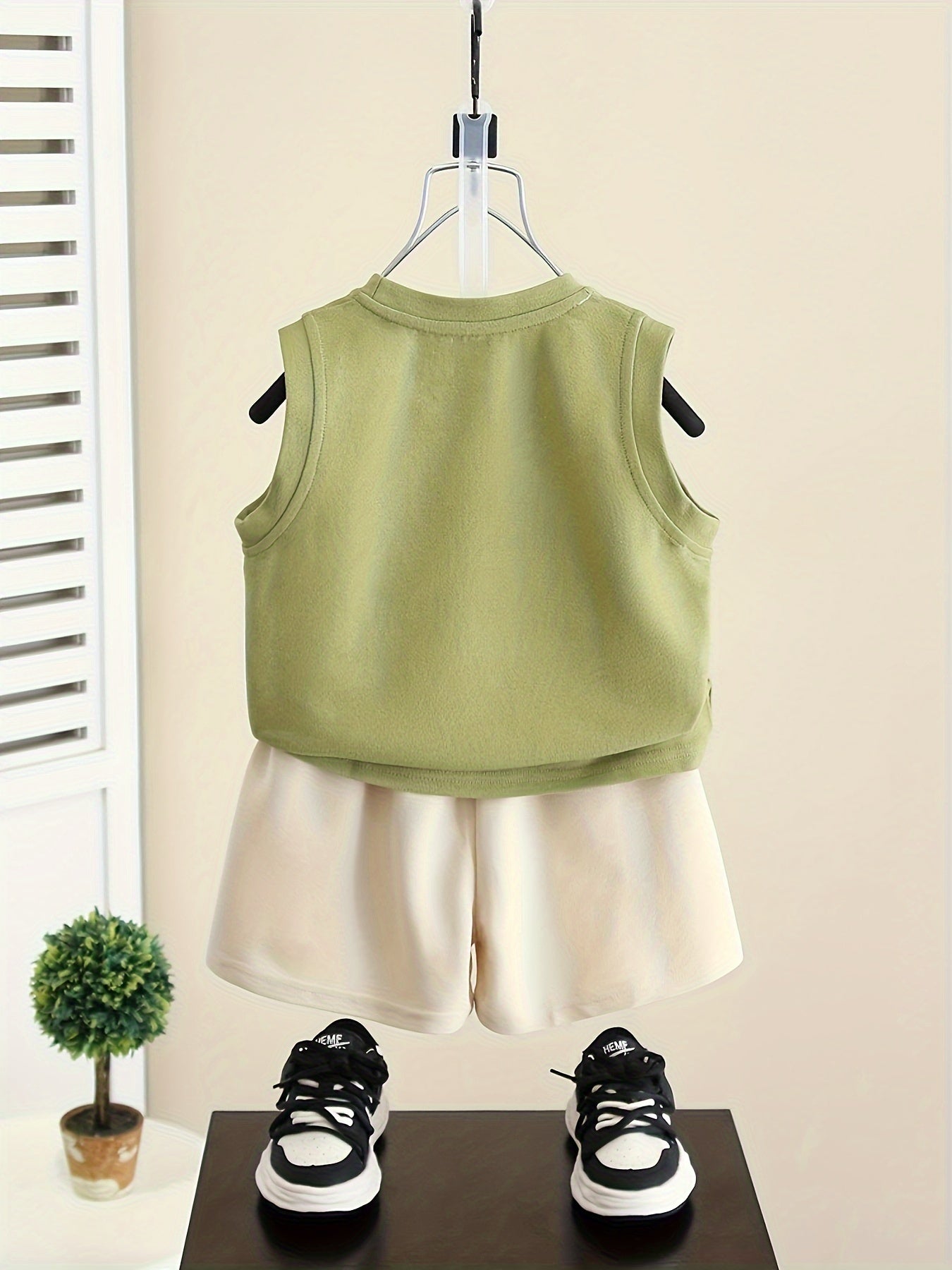 Baby boys 2-piece cotton set with sleeveless round neck vest, cap design, and shorts in green/beige. Perfect for summer wear.