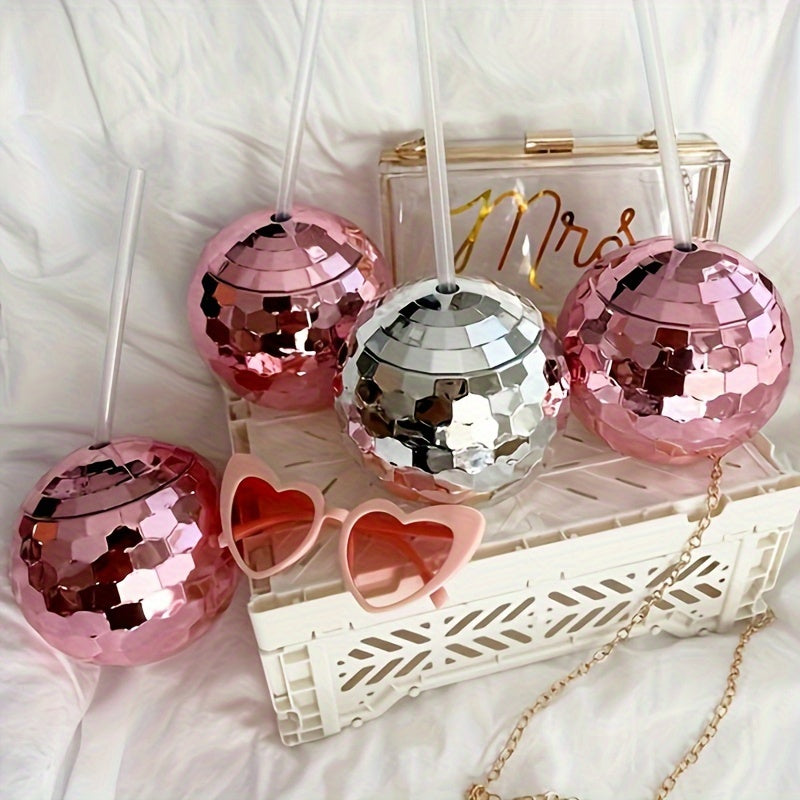 Spherical glitter ball cup with straw, perfect for parties.