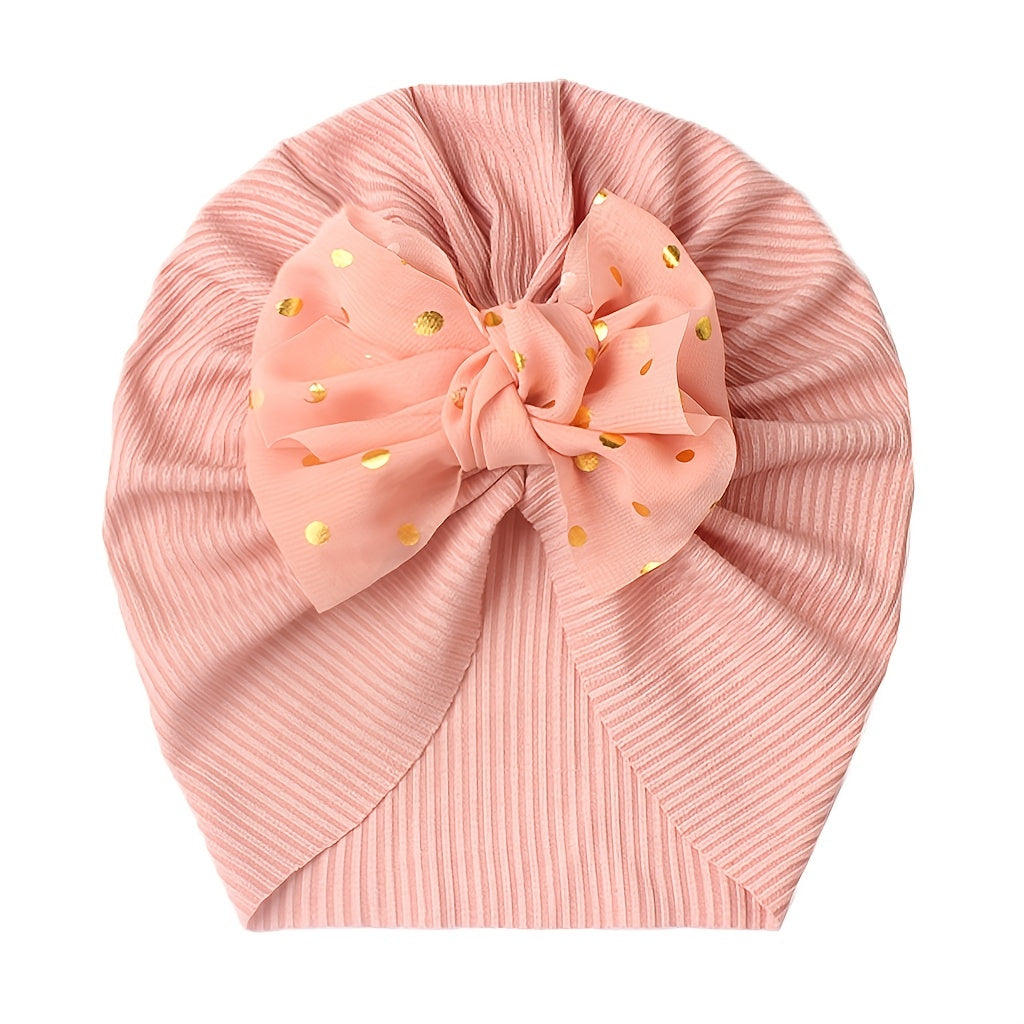 Polka dot printed bow head wrap for newborn infants and toddlers.