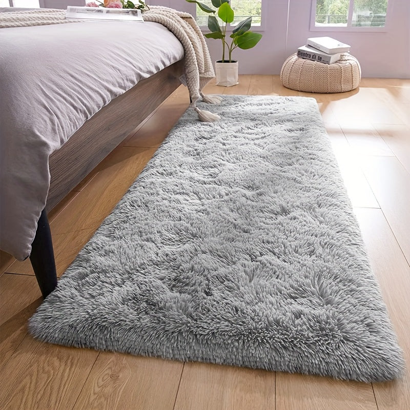 Soft and plush modern shaggy area rug, perfect for adding comfort and style to any indoor space. Made of polyester material, this decorative rug is ideal for living rooms, bedrooms, studies, and lounges. Dry clean only.