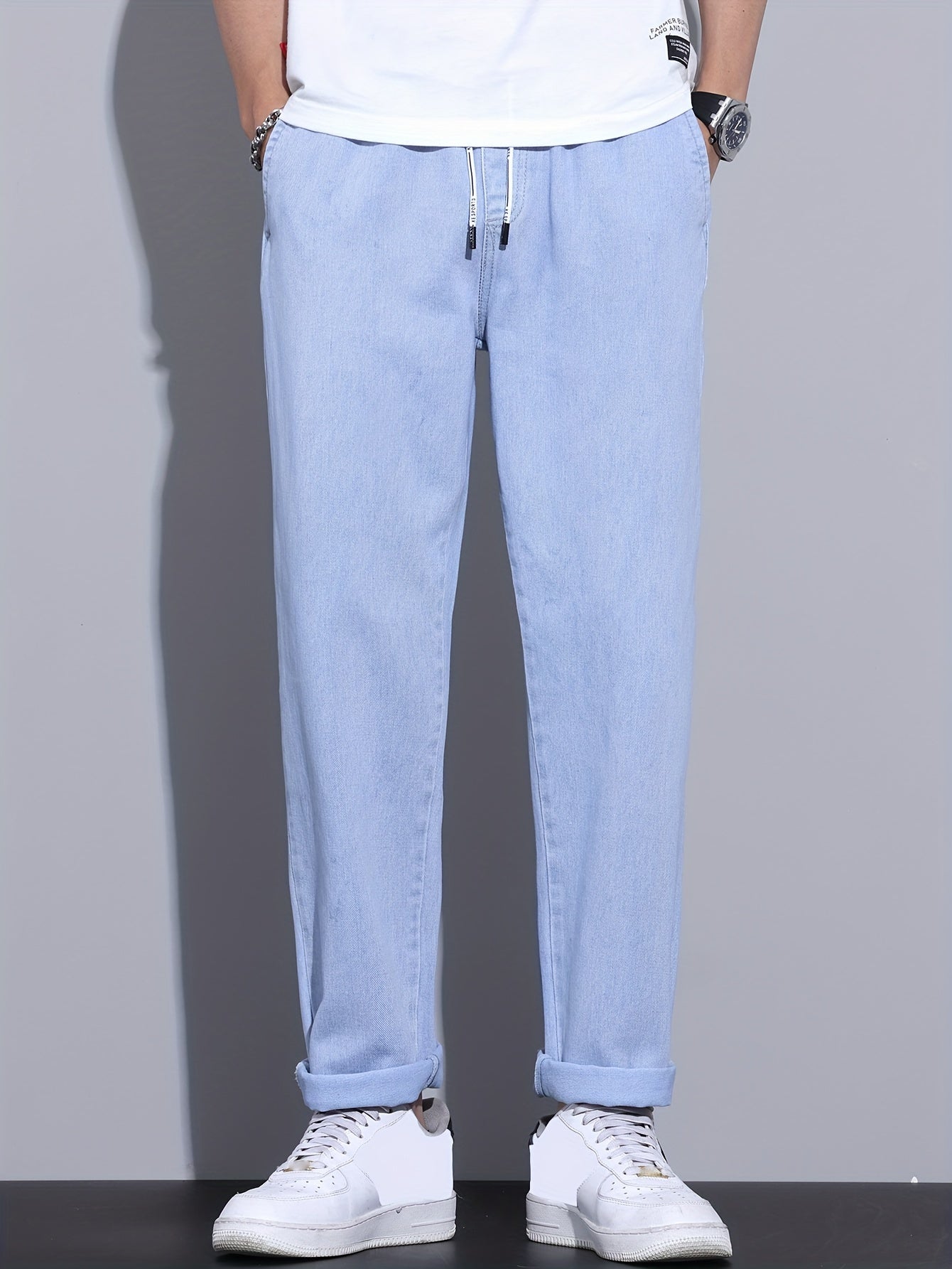 Men's light blue drawstring waist straight-leg jeans in glossy fabric, perfect for all seasons.