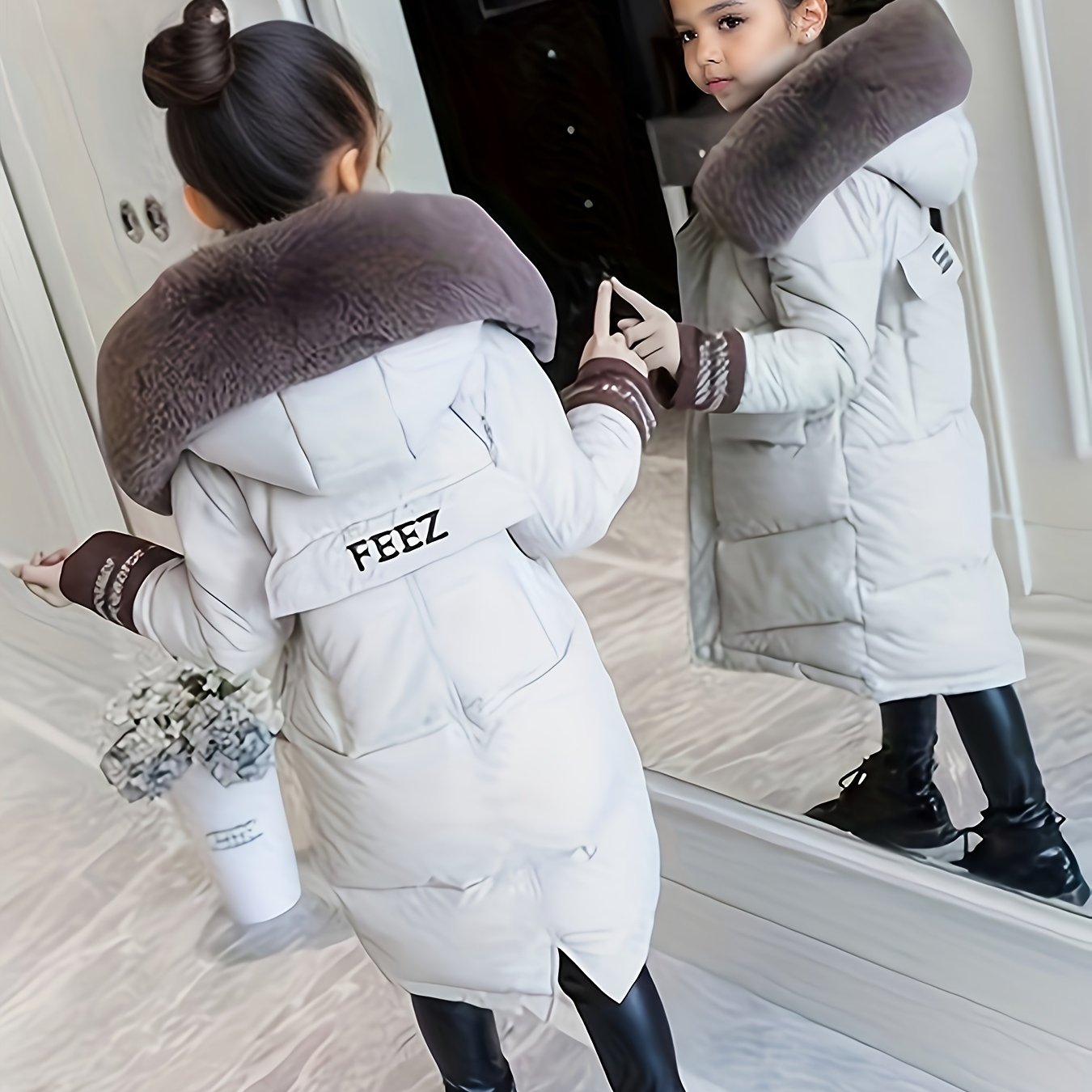 Stylish mid-length winter coat with faux fur hood for Korean fashion lovers. Made of 100% polyester and machine washable, with striped cuffs for added flair.