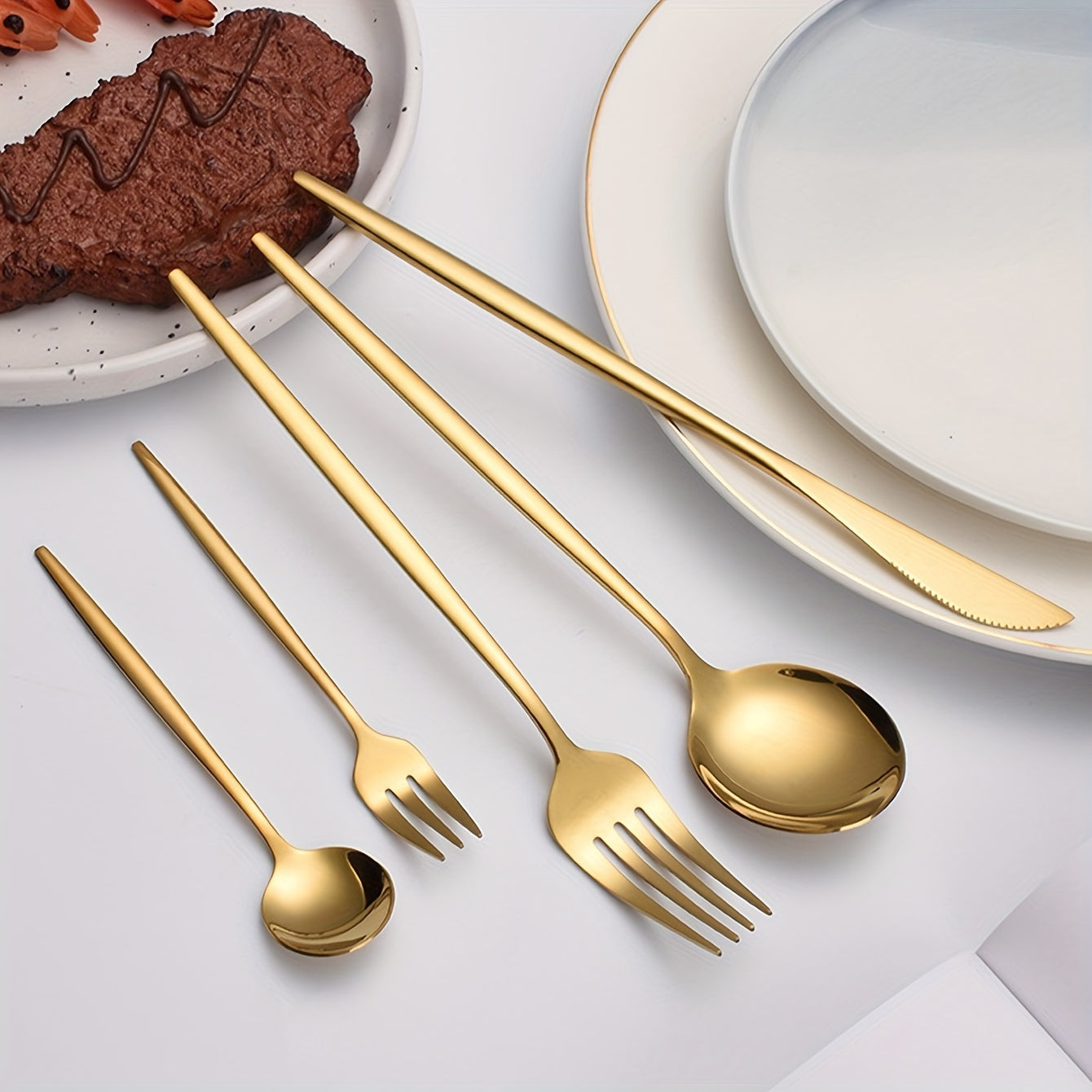 Stainless steel flatware set with a golden finish and elegant modern design for home, kitchen, restaurant, and wedding use.