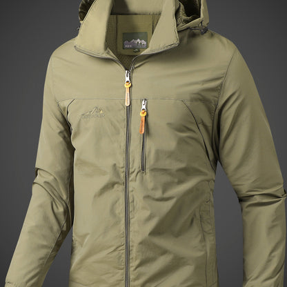 Men's lightweight hooded polyamide jacket with zipper closure and polyester lining, ideal for hiking and outdoor activities in the spring/fall season.