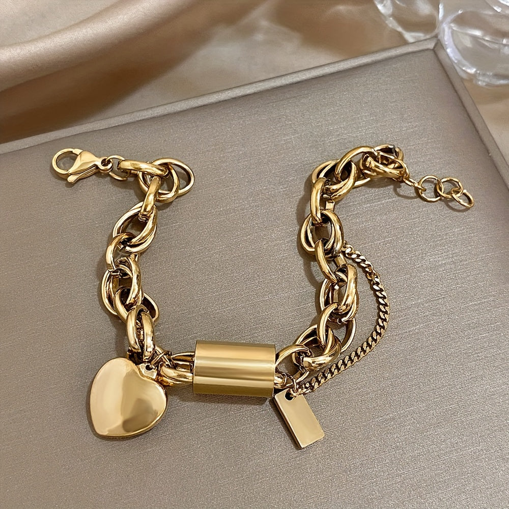 Fashionable heart pendant wrist jewelry made of thick gold-colored stainless steel chain with a punk and chunky design.