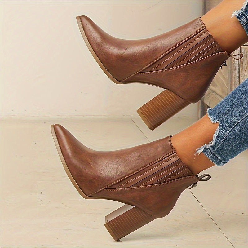 Trendy slip-on ankle boots in solid colors with chunky heels and a pointed toe.