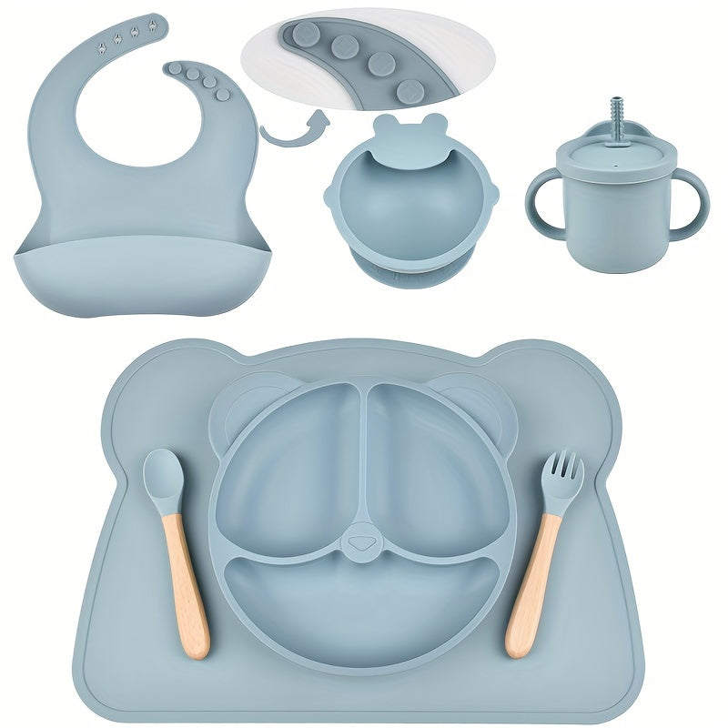 7-piece toddler meal set with silicone utensils in mixed colors, featuring cartoon design and high suction power. Easy to clean and includes placemat, plate, bowl, spoon, fork, bib, and