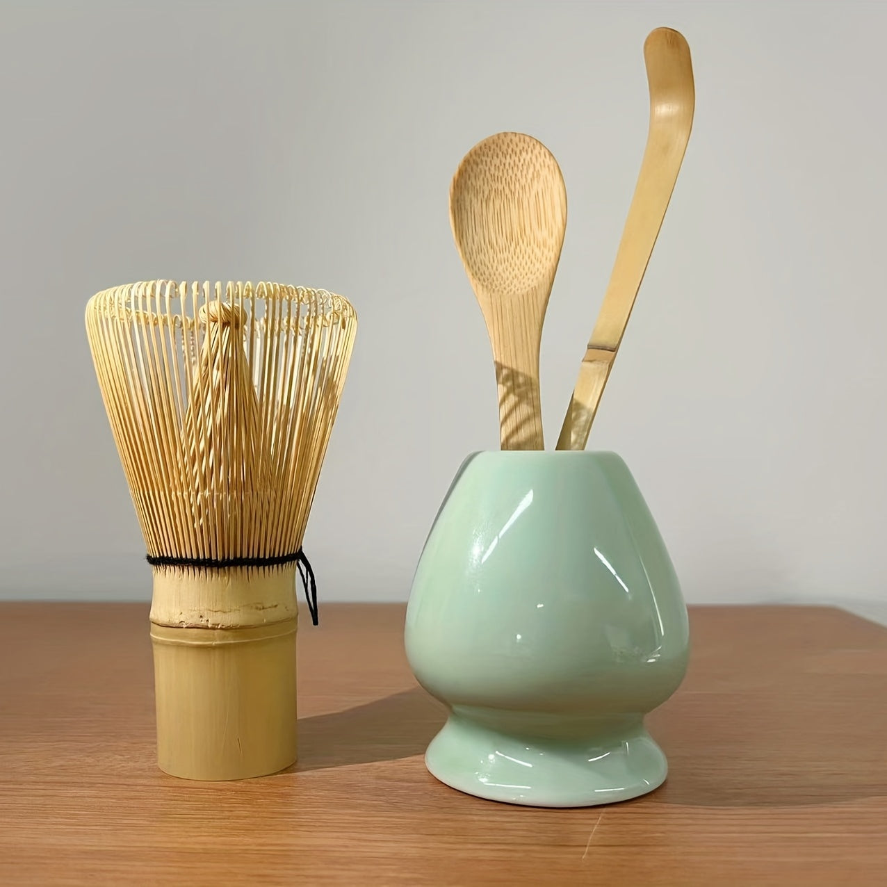 A set of 4 Japanese Matcha Ritual Accessories, including a Momonri Traditional Spoon, Tea Spoon, Matcha Egg Beater, and other accessories. This perfect set is ideal for preparing traditional Matcha. The set features a natural bamboo tea egg beater in