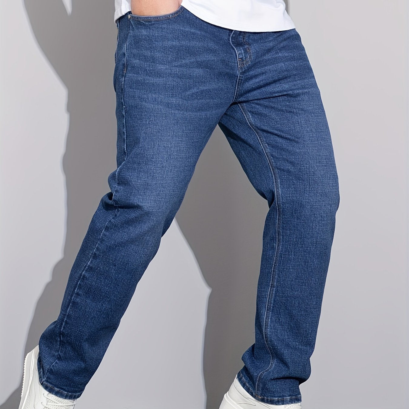 Men's plus size denim jeans with comfort flex, straight leg, washed detail, solid color, cotton blend with stretch.