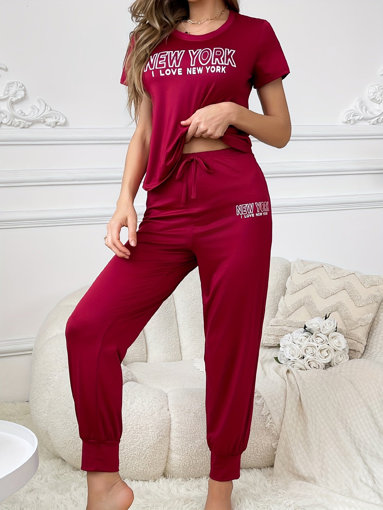 Slogan print pajama set for women, including short sleeve t-shirt and drawstring joggers.