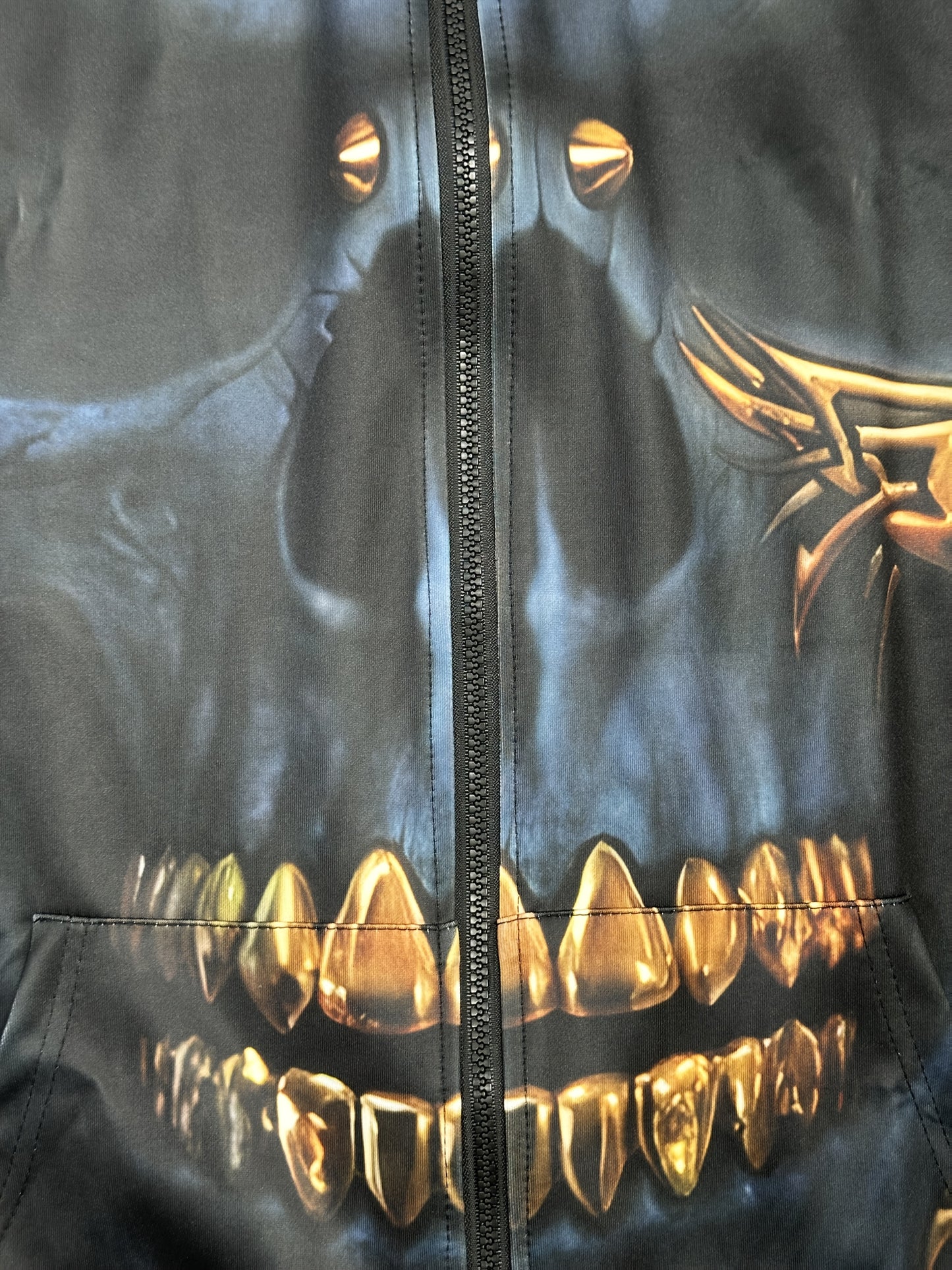 Men's casual hoodie with zipper pocket, featuring a 3D skull print and stretchy polyester knit fabric.